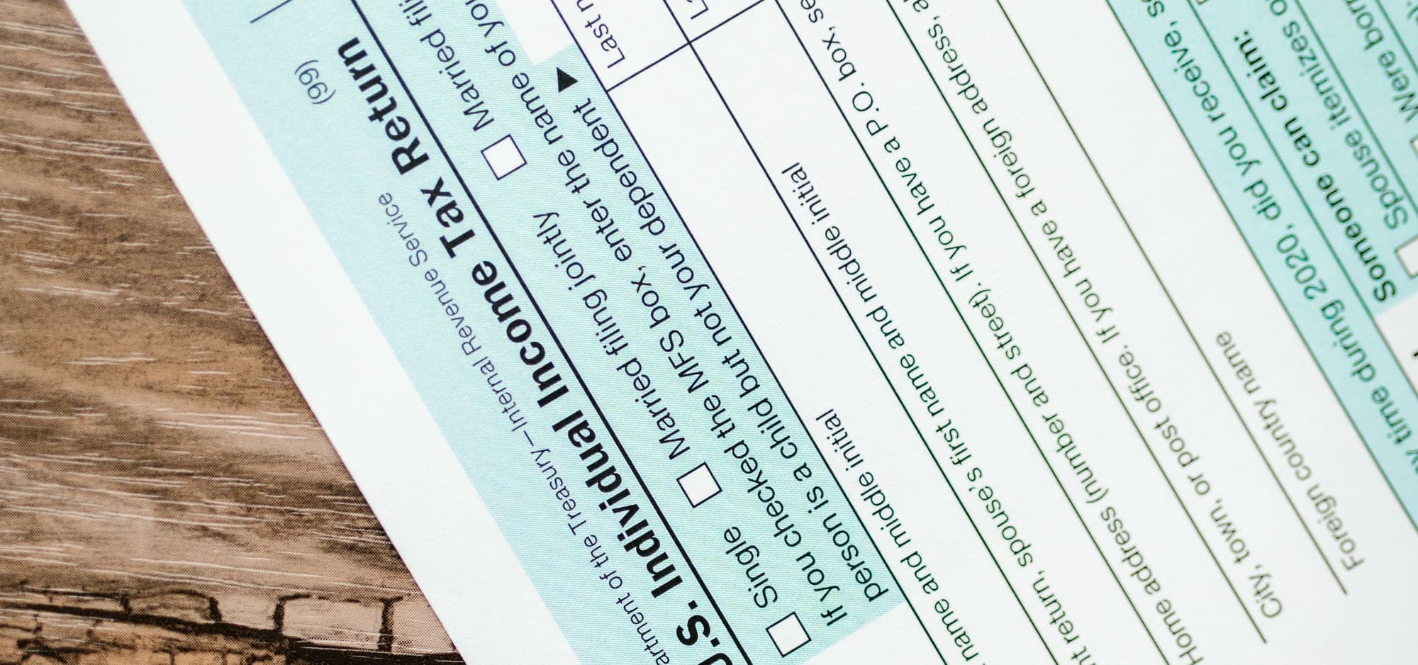 Close-up of a Form 1040, U.S. Individual Income Tax Return, on a wooden desk