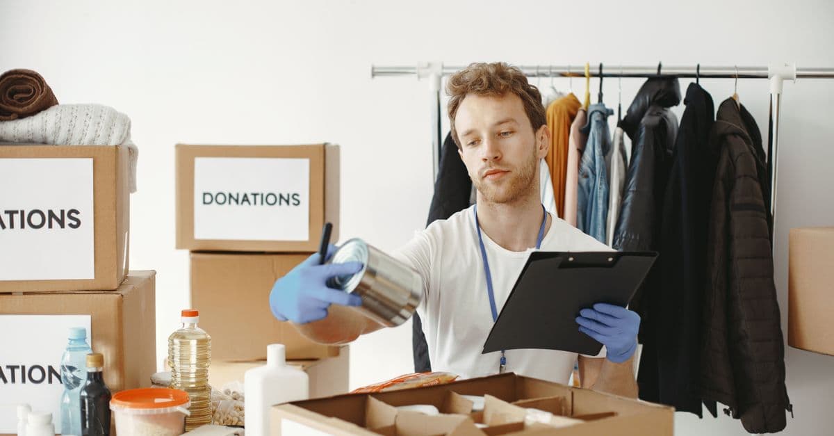 Volunteer inventorying food and clothing donations