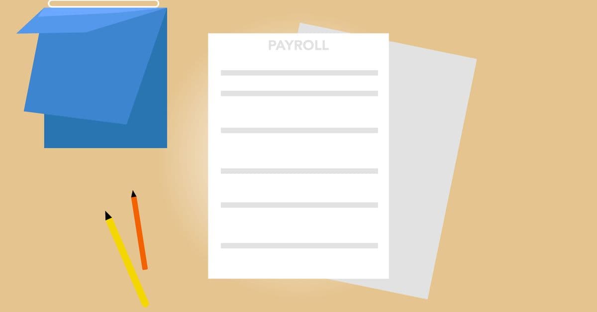 Payroll documents and a calendar arranged on a desk