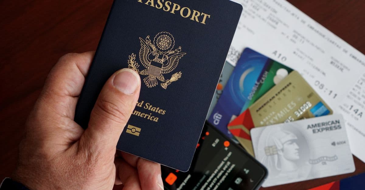 United States passport with travel documents, cards, and a phone